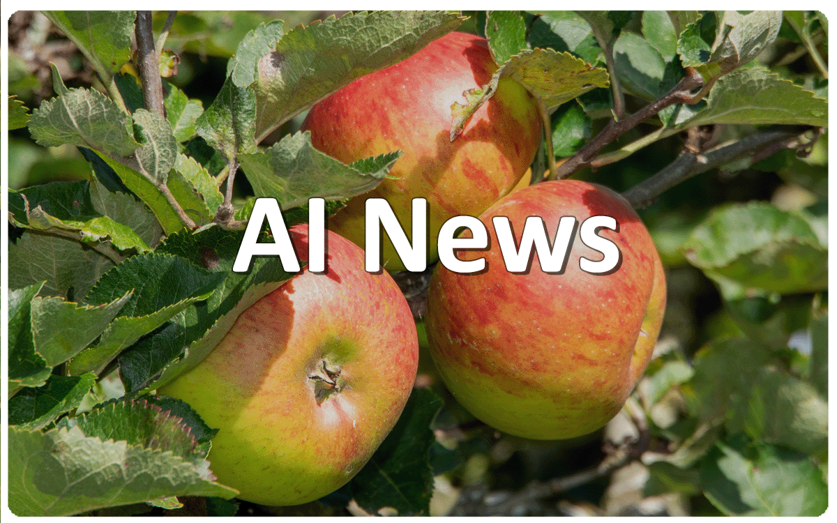Text AI News over three ripe apples amongst apple leaves